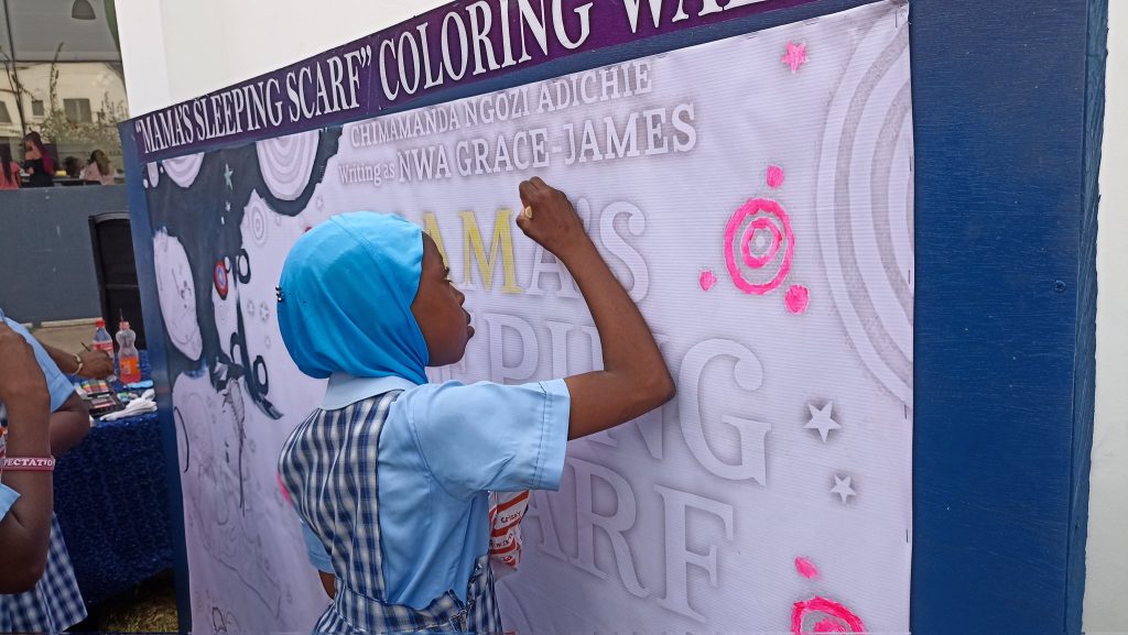 A pupil painting canvas of the Book Signing of Author Chimamanda Ngozi Adichie Hosts Book Launch in Lagos (News Central TV)