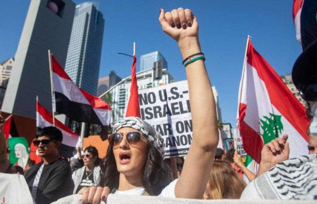 Man Sets Arm Ablaze as Thousands March in U.S. Cities Calling for Gaza Ceasefire