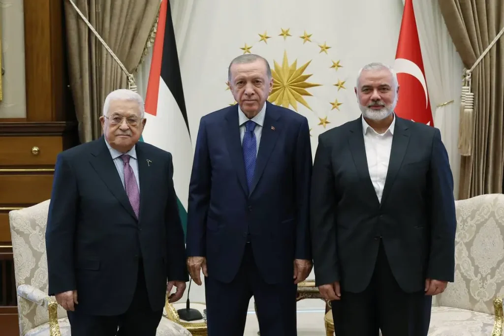 Erdogan with Palestinian President Mahmoud Abbas (L) and Head of the Hamas Political Bureau Ismail Haniyeh